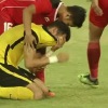 Para pemain Malaysia menangis setelah dikalahkan Indonesia 