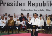 Menguji kesaktian janji tiga kartu baru Jokowi