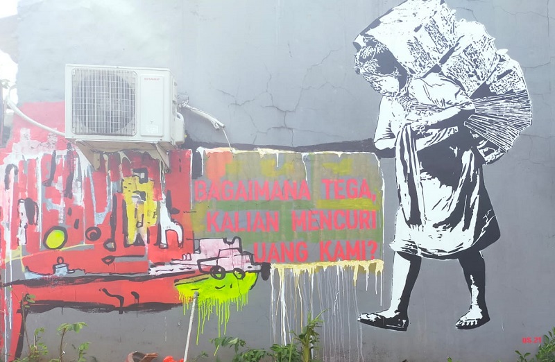Mural bergambar ibu kuli panggul Pasar Beringharjo karya seniman Degie Sigit. Foto Alinea.id/Khudori.